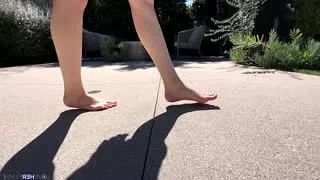 Skinny doing footjob on photoshoot